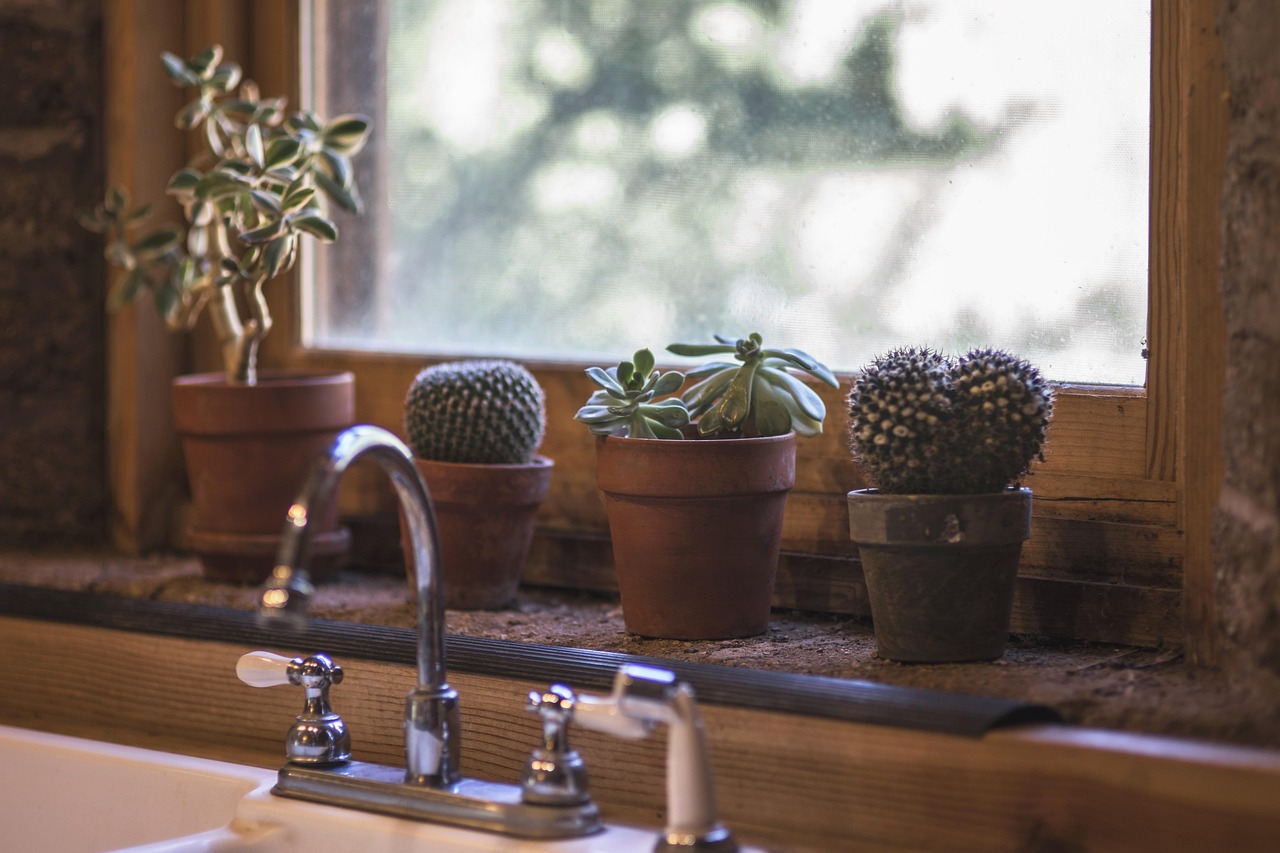 Warm wood vanity with a white quartz top and matte black faucet